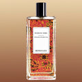 Berdoues Russkaya Кожа tall rectangular perfume bottle with a red, orange and black design on it, a white label with black lettering, a black cylindrical cap on a warm gradient background.