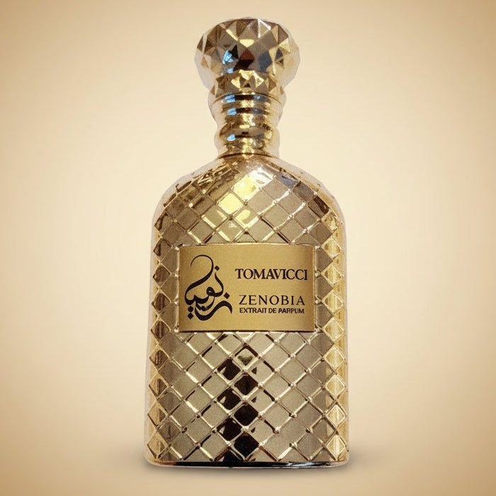 Tomavici Zenobia Extract of Parfum in a textured gold glass bottle with a faceted cap and a gold label.